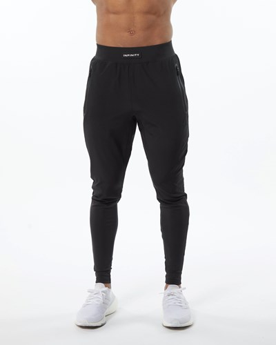 Alphalete Woven 4-Way Stretch 29" Pant Blackout | UHNIT9346