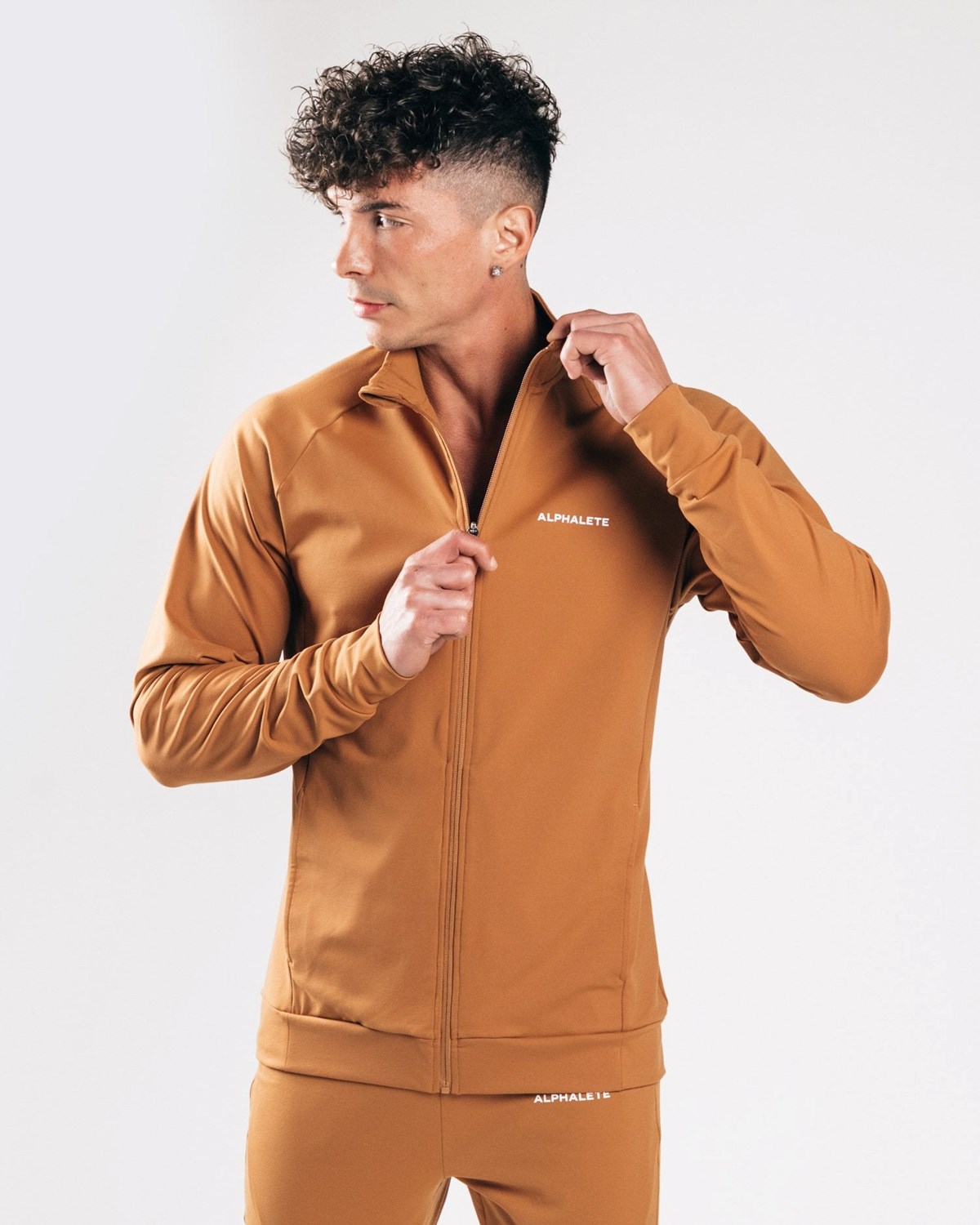 Alphalete 4-Way Stretch Track Jacket Camel | MBOXC4013