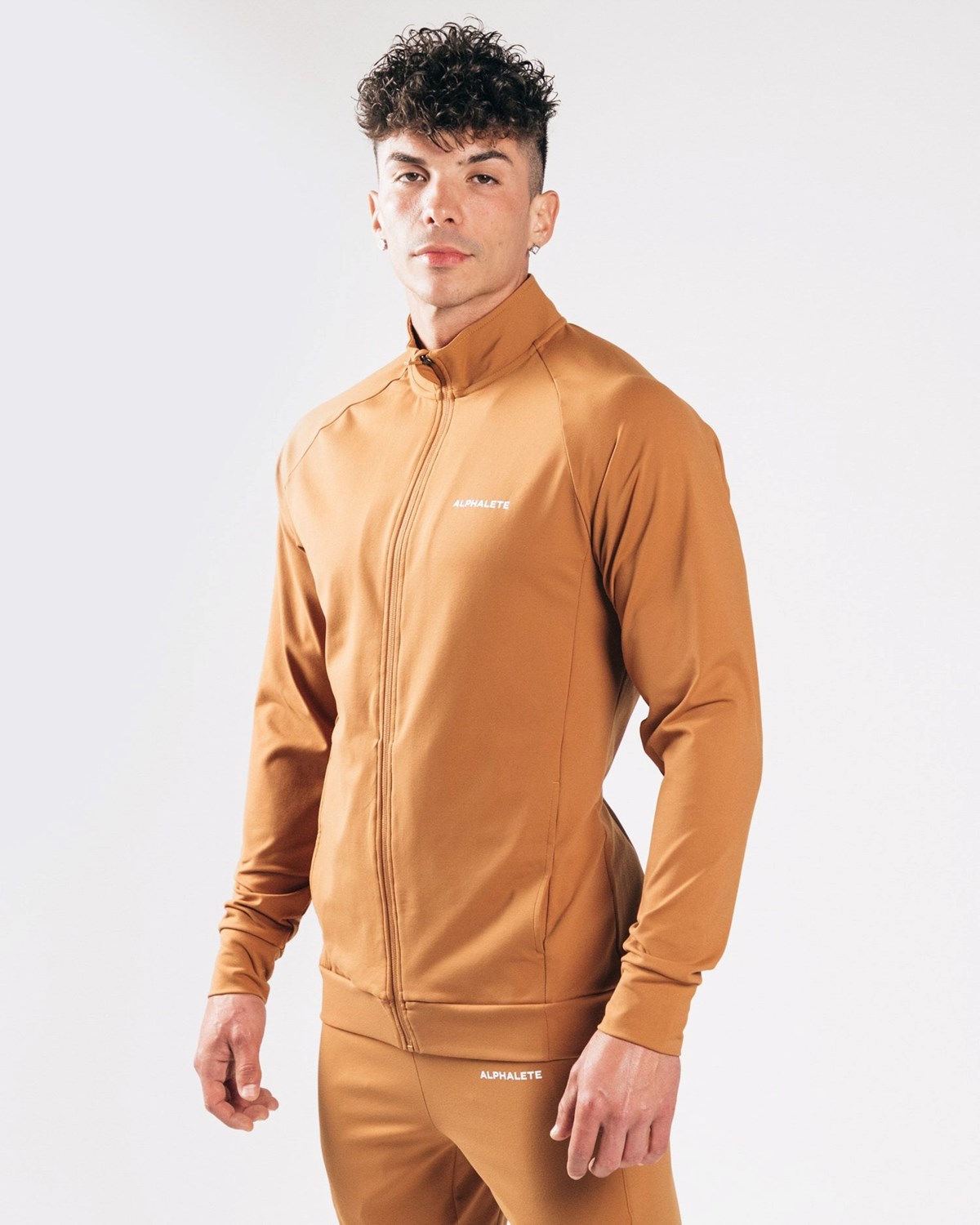 Alphalete 4-Way Stretch Track Jacket Camel | MBOXC4013