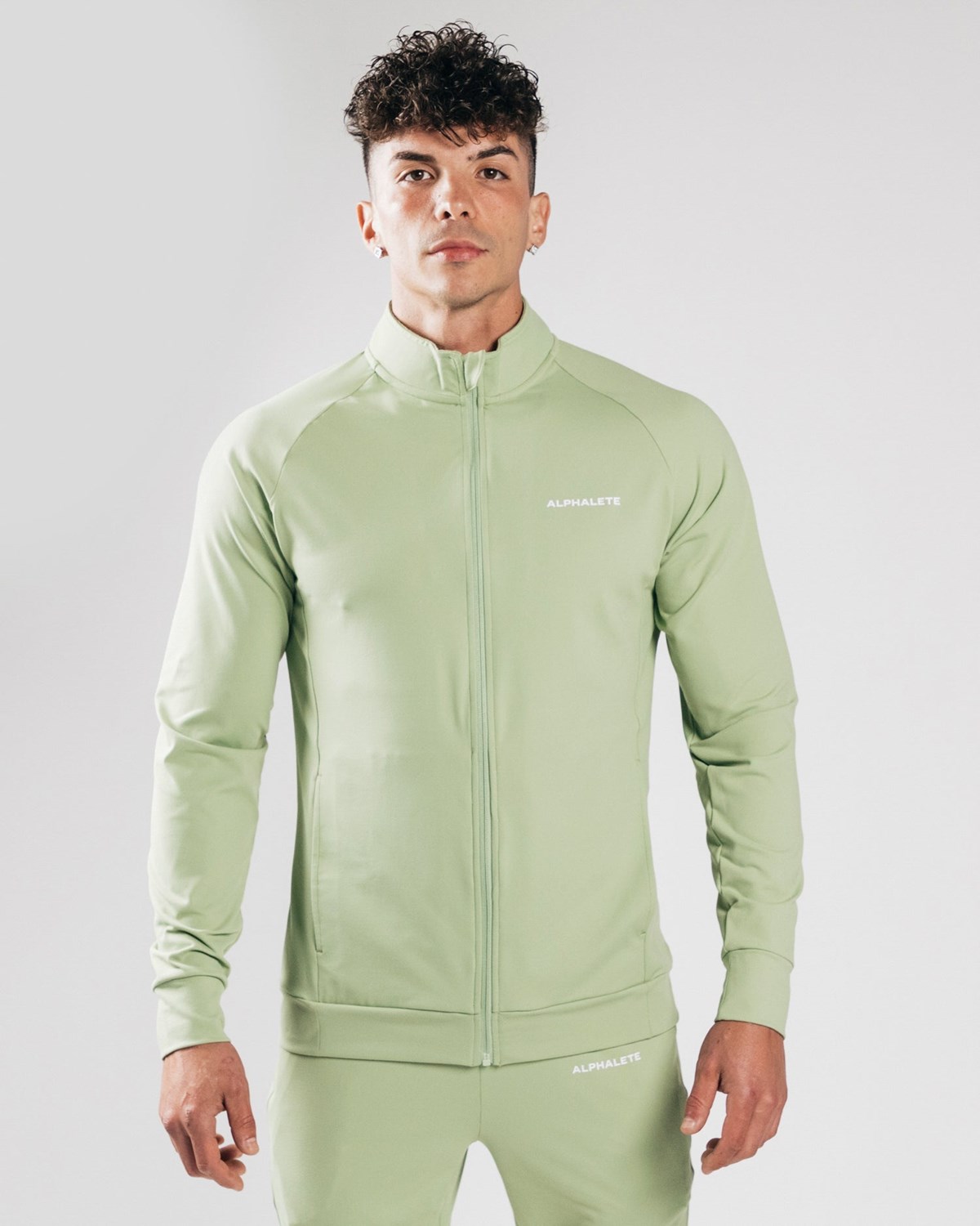 Alphalete 4-Way Stretch Track Jacket Frozen Spring | FZWLJ5406