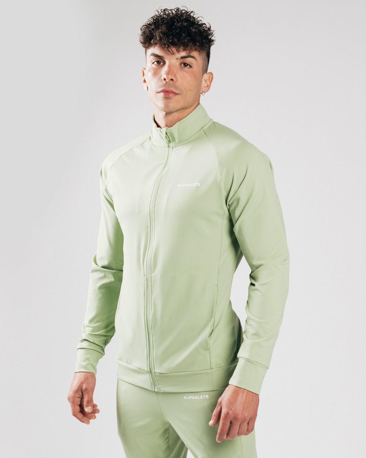 Alphalete 4-Way Stretch Track Jacket Frozen Spring | FZWLJ5406