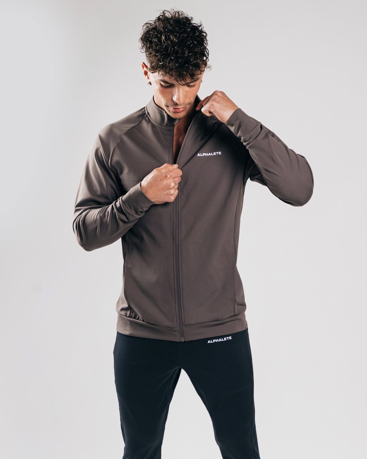 Alphalete 4-Way Stretch Track Jacket Striker | CDYSO3096