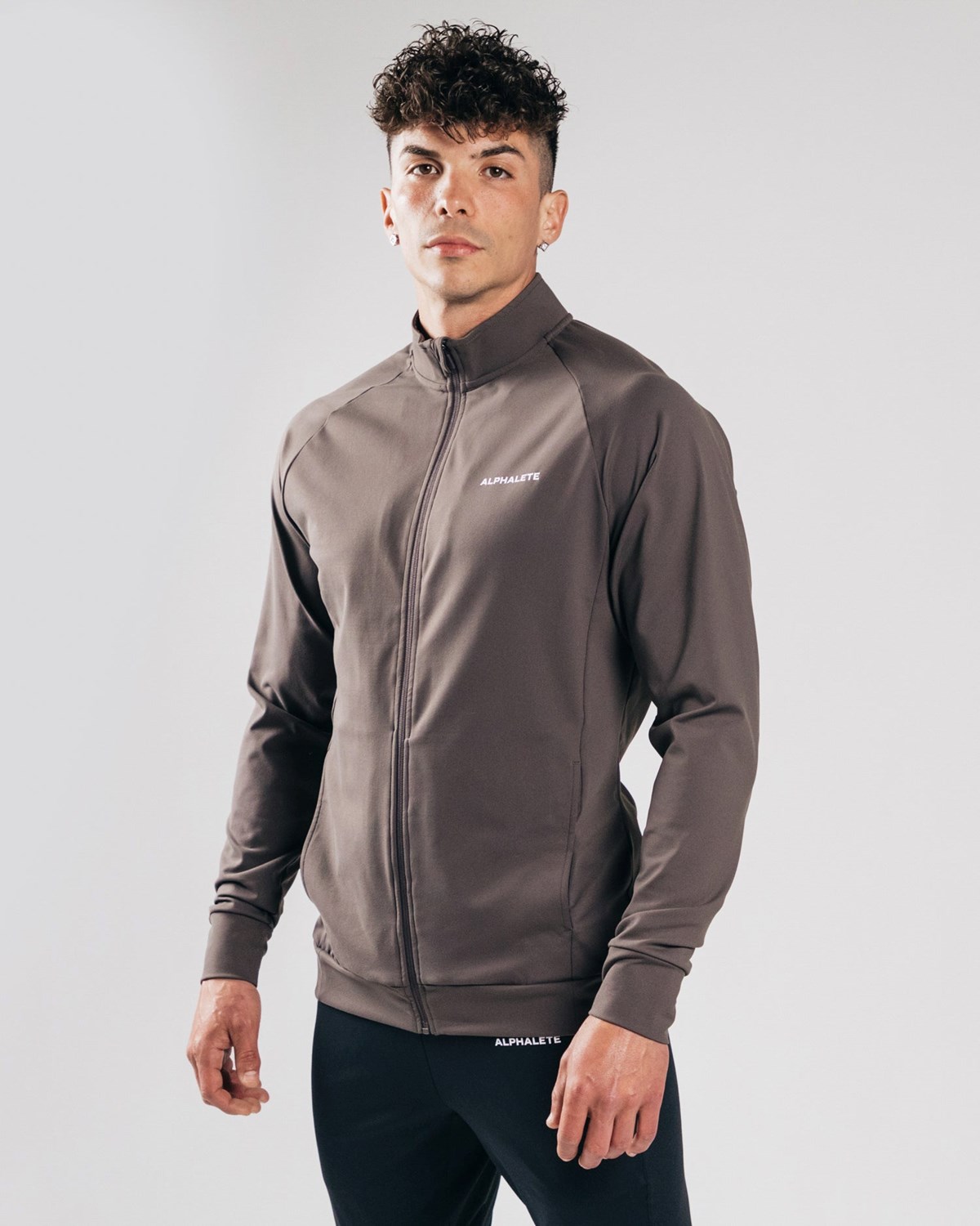 Alphalete 4-Way Stretch Track Jacket Striker | CDYSO3096